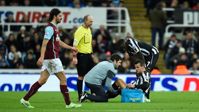 Newcastle United player Steven Taylor is treated for an injury against Burnley