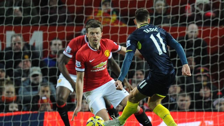 Southampton's Serbian midfielder Dusan Tadic strikes low to open the scoring at Old Trafford.