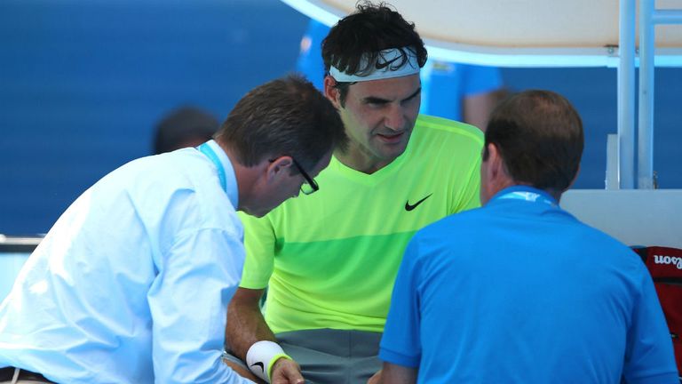 Roger Federer receives medical attention in his match against Simone Bolelli at the 2015 Australian Open