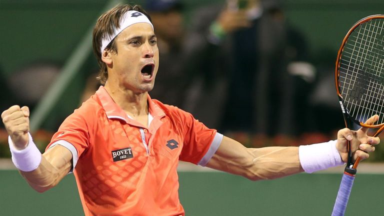 David Ferrer celebrates after beating Ivo Karlovic of Croatia during their semi-final in Qatar's ExxonMobil Open in Doha
