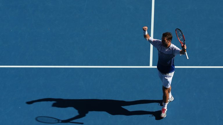 Stanislas Wawrinka of Switzerland celebrates winning his quarter-final match against Kei Nishikori of Japan 