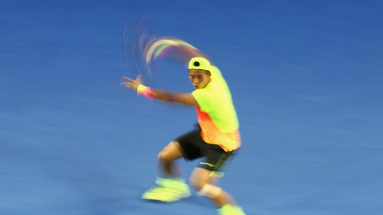  Ze Zhang of China plays a forehand in his first round match against Lleyton Hewitt of Australia during day two 