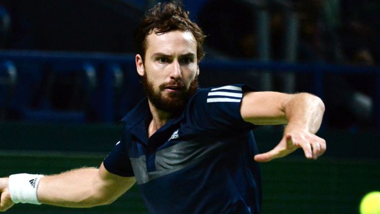 Ernest Gulbis returns a ball to Roberto Bautista Agut during the Kremlin Cup tennis tournament semi-final