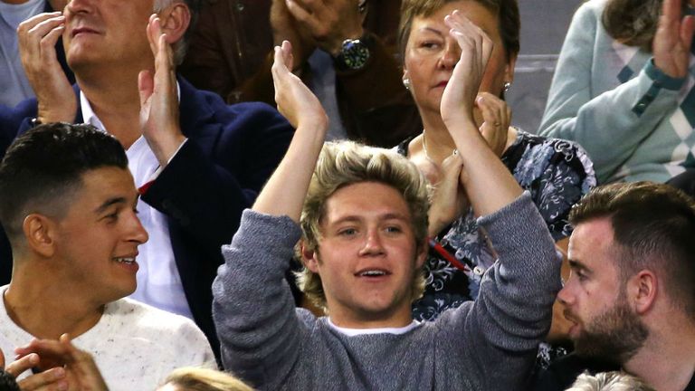 Niall Horan from One Direction watches the action at Rod Laver Arena during 2015 Australian Open
