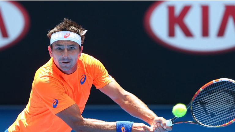 Marinko Matosevic plays a backhand in his second round match against Andy Murray during the 2015 Australian Open