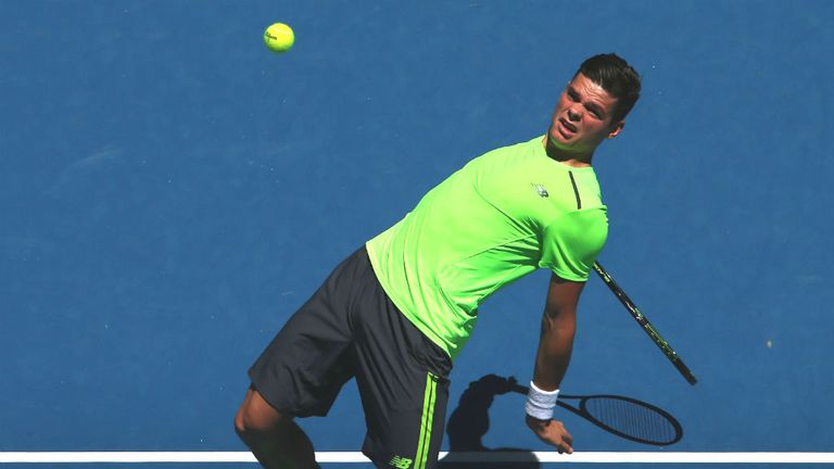 Milos Raonic plays a shot during his match against Benjamin Becker at the 2015 Australian Open