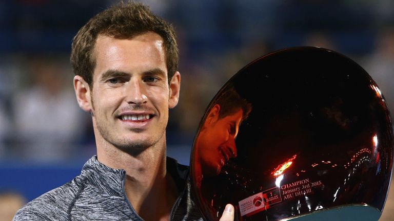 Andy Murray poses with the trophy after winning the the Mubadala World Tennis Championship