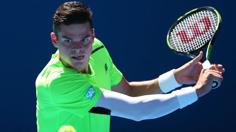 Milos Raonic plays a backhand in his third round match against Benjamin Becker at the 2015 Australian Open