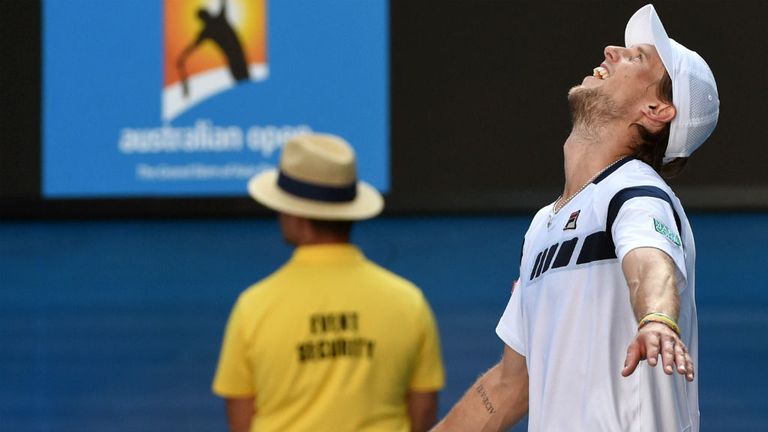 Andreas Seppi celebrates after victory against Roger Federer on day five of the 2015 Australian Open 