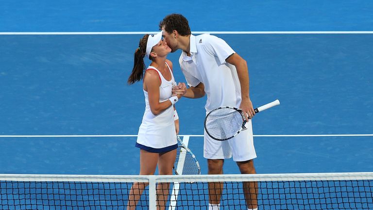 Agnieszka Radwanska and Jerzy Janowicz of Poland celebrate after winning the mixed doubles against Alize Cornet and Benoit P