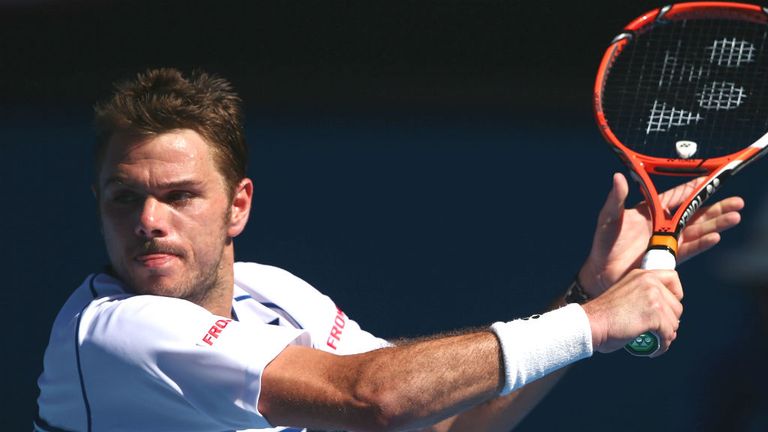 Stan Wawrinka plays a backhand in his match against Jarkko Nieminen during the 2015 Australian Open