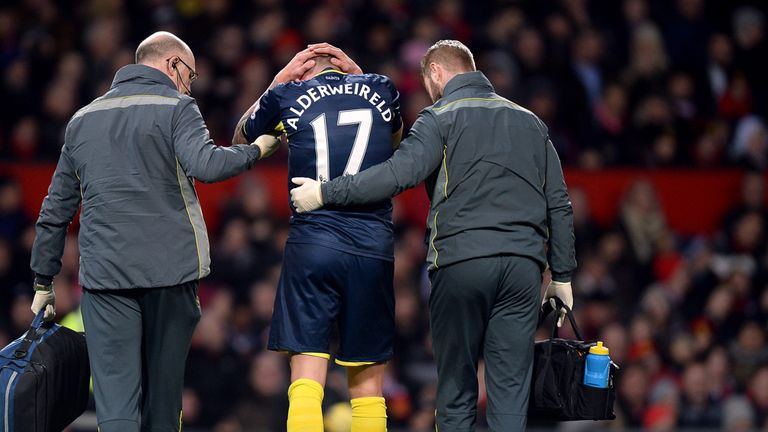 Southampton's Toby Alderweireld receives treatment for an injury before going off against Manchester United