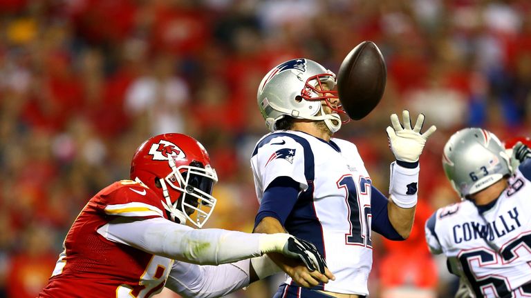 KANSAS CITY, MO - SEPTEMBER 29:  Tamba Hali #91 of the Kansas City Chiefs knocks the ball loose from Tom Brady #12 of the New England Patriots for a fumble