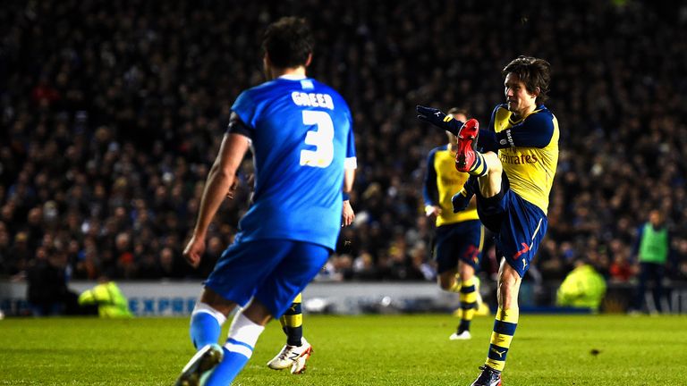 Tomas Rosicky puts Arsenal 3-1 up against Brighton.