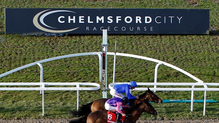 CHELMSFORD, ENGLAND - JANUARY 11: Adam Kirby riding Tryster (blue) win the opening race, The Betfred Handicap Stakes from Gaelic Silver during the first me