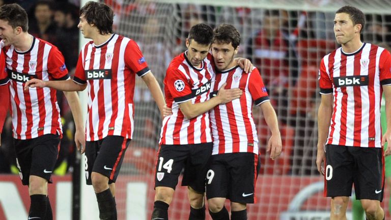 Athletic Bilbao's Unai Lopez (2nd R) celebrates with his teammate midfielder Markel Susaeta (3rd R) after scoring during the UEFA Champions League 