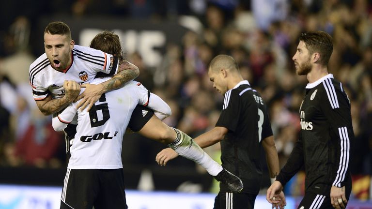 Valencia's Argentinian defenders Nicolas Otamnedi (L)  and Lucas Orban celebrate their victory over Real Madrid