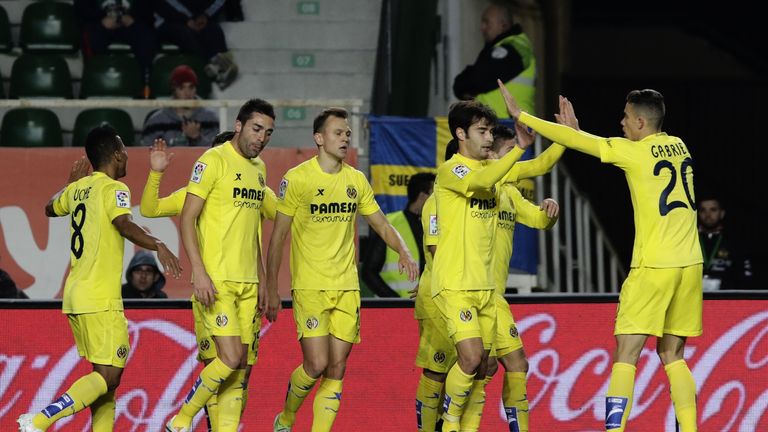 Villareal players celebrate their first goal during the Spanish league football match Elche FC vs Villarreal CFat the Martinez Valero stadium in Elche 