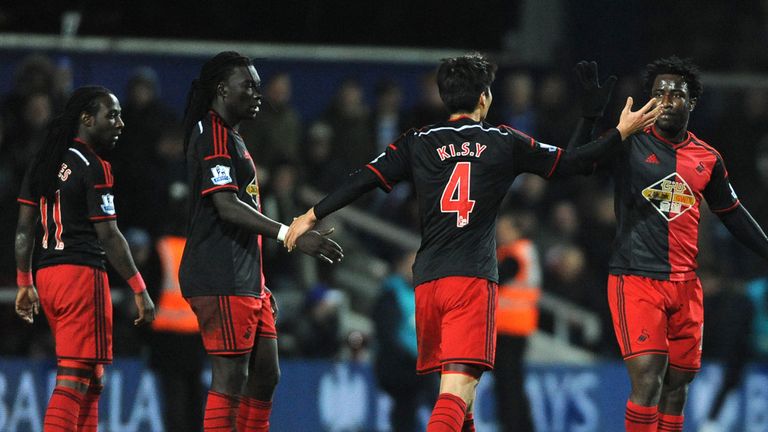 Wilfried Bony, right, celebrates his equaliser at Loftus Road
