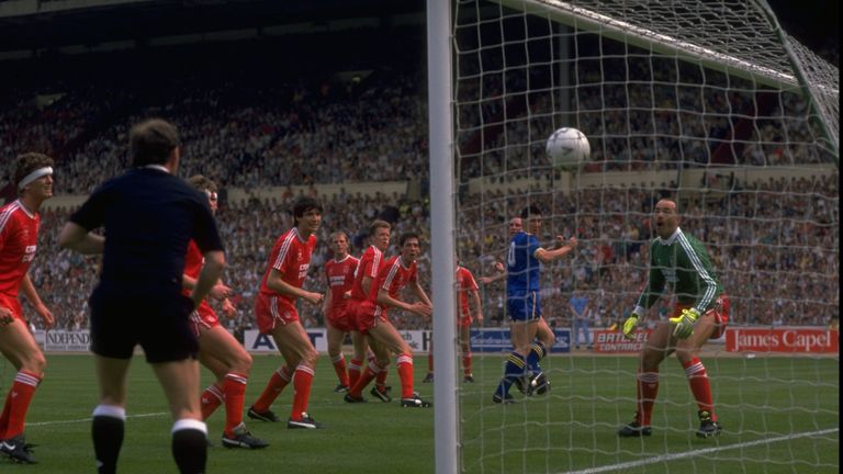 Liverpool players stand and watch as Lawrie Sanchez of Wimbledon beats Bruce Grobbelaar to score the winning goal during the 1988 FA Cup final at Wembley.