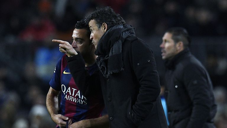 Barcelona's coach Luis Enrique talks with Barcelona's midfielder Xavi Hernandez during the Spanish Copa del Rey 