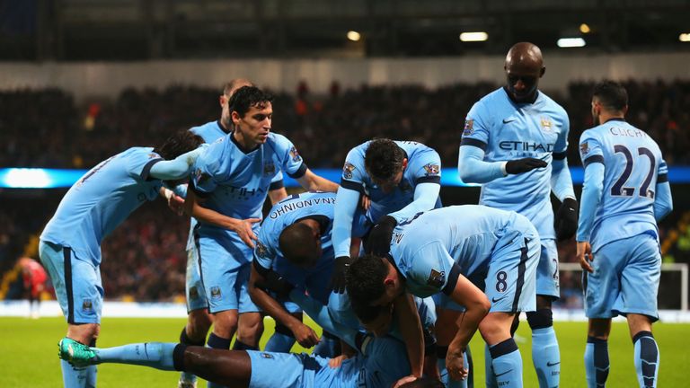 Yaya Toure is congratulated after scoring the opening goal against Sunderland