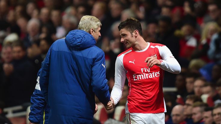 Arsene Wenger, manager of Arsenal shakes hands with Olivier Giroud of Arsenal during the FA Cup fifth round match v Middlesbrough