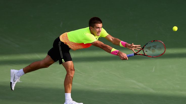 Borna Coric of Croatia in action against Andy Murray of Great Britain.