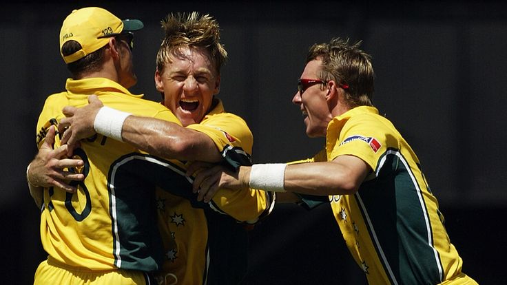 PORT ELIZABETH- MARCH 2:   Andy Bichel and Adam Gilchrist of Australia celebrate the wicket of Andrew Flintoff of England during the ICC World Cup One Day 