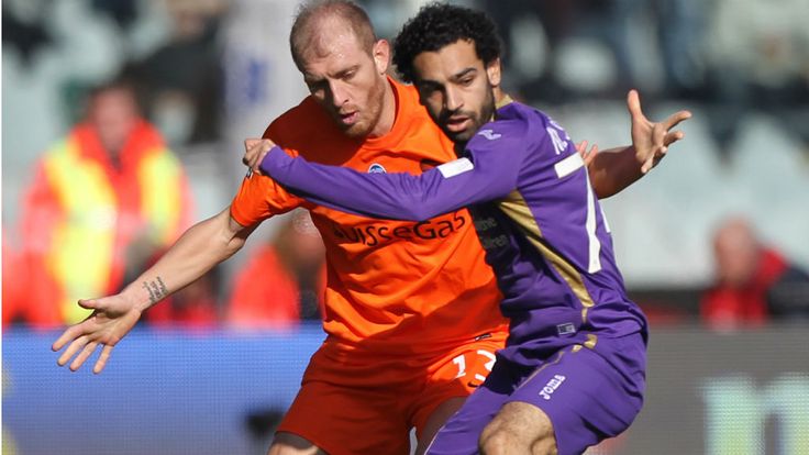Andrea Masiello of Atalanta competes for the ball with Mohamed Salah of Fiorentina during the Serie A match