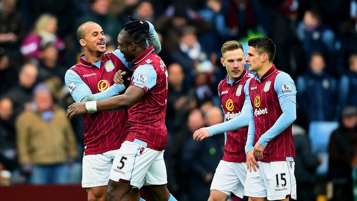 Jores Okore of Aston Villa celebrates with team-mates after scoring his team's first goal during the Premier League match against Chelsea at Villa Park