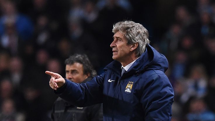Manchester City's Chilean manager Manuel Pellegrini (R) gestures from the touchline during the UEFA Champions 