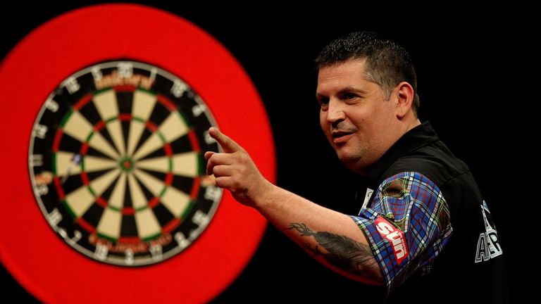 Gary Anderson of Scotland celebrates winning a leg during the McCoys Premier League Darts Play-Offs Semi Final match, May 2014