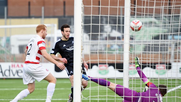 Aberdeen's Andrew Considine capitalises on a defensive error from Hamilton's Ziggy Gordon to give his side the lead 0-1