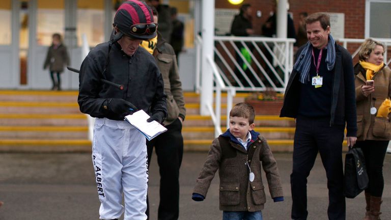 NEWBURY, ENGLAND - FEBRUARY 07: Tony McCoy finds time to sign aurographs at Newbury racecourse.