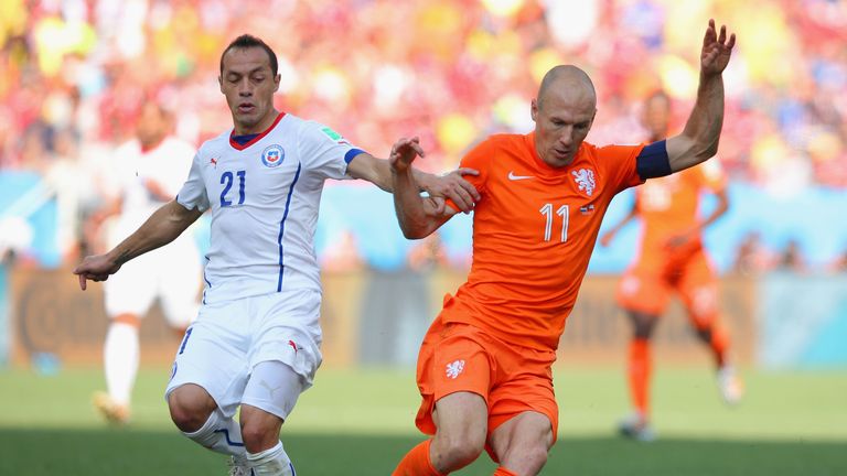Arjen Robben of the Netherlands controls the ball against Marcelo Diaz of Chile during the 2014 FIFA World Cup Brazil Group B