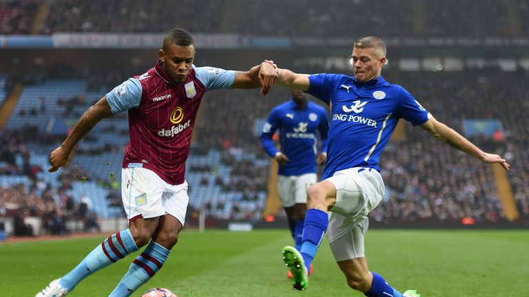 Paul Konchesky of Leicester City challenges Leandro Bacuna of Aston Villa during the FA Cup fifth round match between Aston Villa and Leicester City
