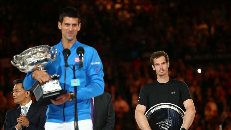 Novak Djokovic of Serbia holds the Norman Brookes Challenge Cup, and Andy Murray of Great Britain holds the runner up trophy, Australian Open final