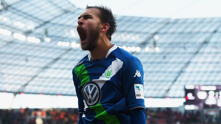LEVERKUSEN, GERMANY - FEBRUARY 14:  Bas Dost of VfL Wolfsburg celebrates as he scores the fourth goal during 