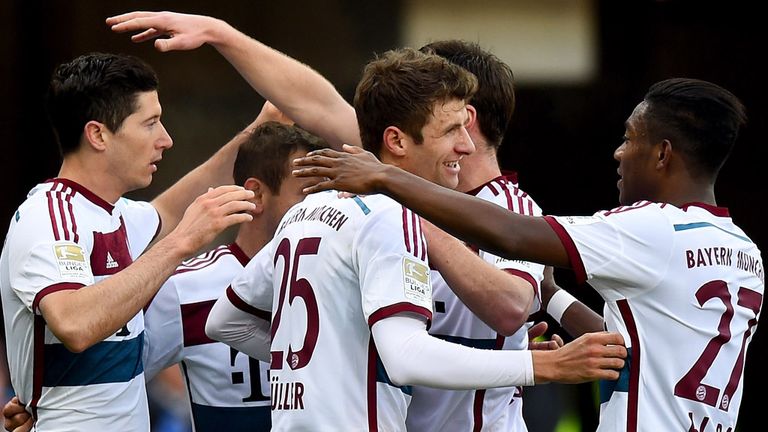  Robert Lewandowski celebrates with team mates after scoring his teams first goal 