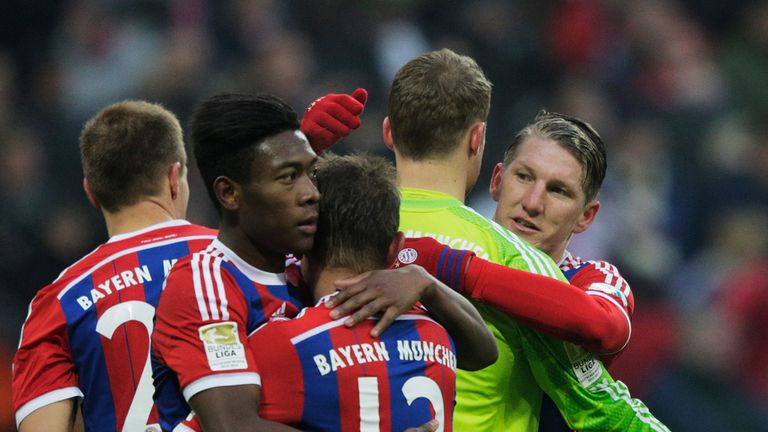 MUNICH, GERMANY - FEBRUARY 14:  Sebastian Schweinsteiger congratulates Manuel Neuer of FC Bayern 