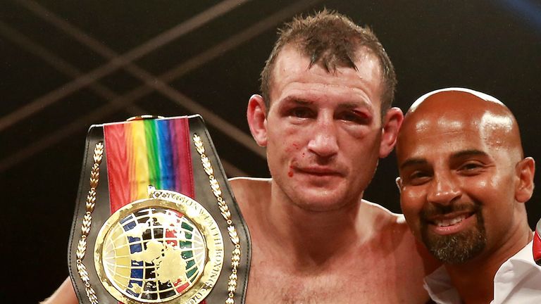 HULL, ENGLAND - JULY 13:  Derry Matthews celebrates his victory over Tommy Coyle with Dave Caldwell during their Vacant Commonwealth Lightweight Championsh