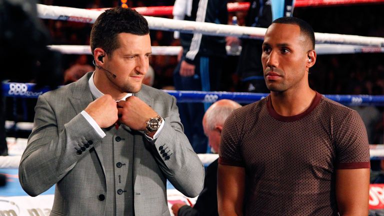 Boxers Carl Froch (L) and James DeGale are seen ringside 