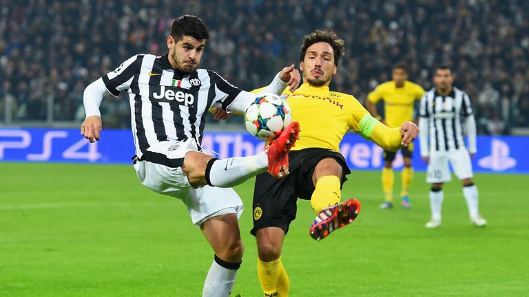 TURIN, ITALY - FEBRUARY 24:  Mats Hummels of Borussia Dortmund battles with Alvaro Morata of Juventus during the UEFA Champions League match