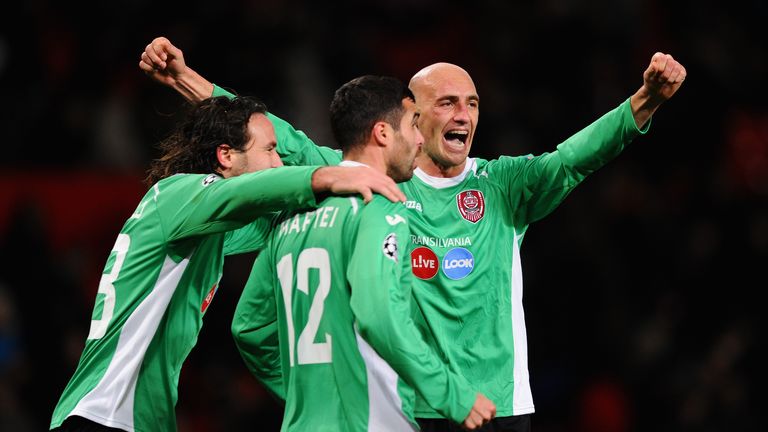Gabriel Muresan of CFR 1907 Cluj celebrates with his team-mates after defeating Manchester United 1-0