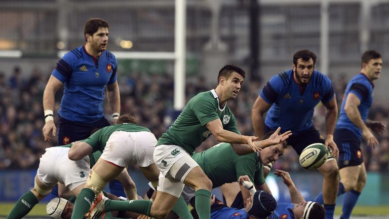 Conor Murray (C) passes the ball out of a ruck