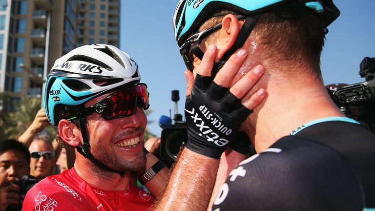 Mark Cavendish (l) of Great Britain and Etixx - Quick-Step celebrates with team mate Tony Martin of Germany aft
