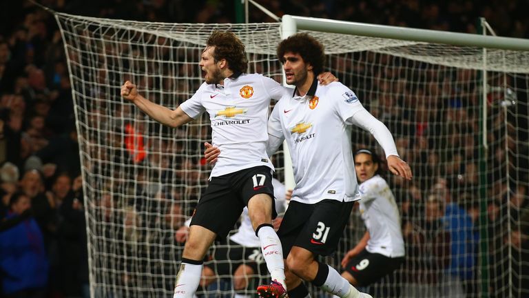 Daley Blind celebrates scoring a goal with Marouane Fellaini of Manchester United during the Premier League match at West Ham