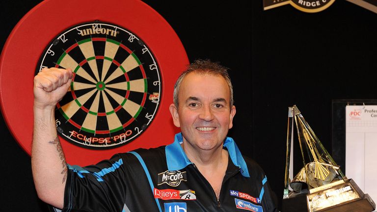 Phil Taylor with Premier League Darts trophy 2012