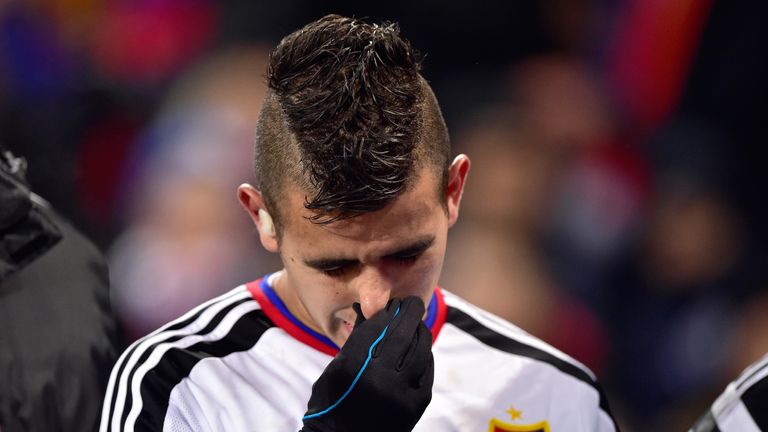 Basel's Paraguayan midfielder Derlis Gonzalez reacts after being injured during the UEFA Champions League round of 16 first leg match between Basel 
